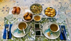 Fuchka for 2! Our meal of fuchka, potato/veggie filling, chaat masala water, various chutneys and toppings and then samosa and polish sausage on the side