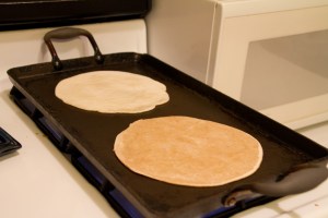A plain one (in back) and whole wheat one (in front) just starting to cook