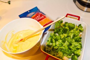 Layer the chicken, then broccoli, then the sauce and then cheese